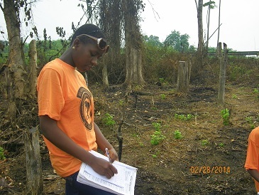 2014 A Form Two student on field trip making notes